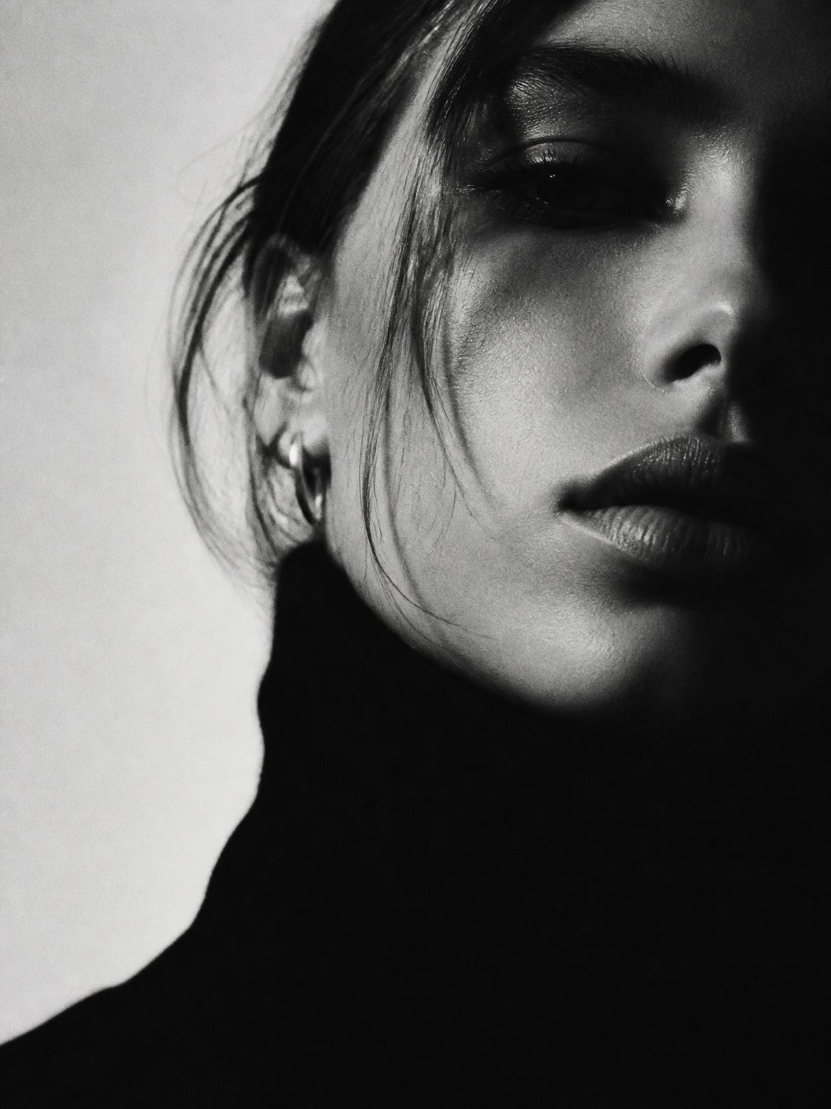 Editorial black and white portrait representing the studio's art direction